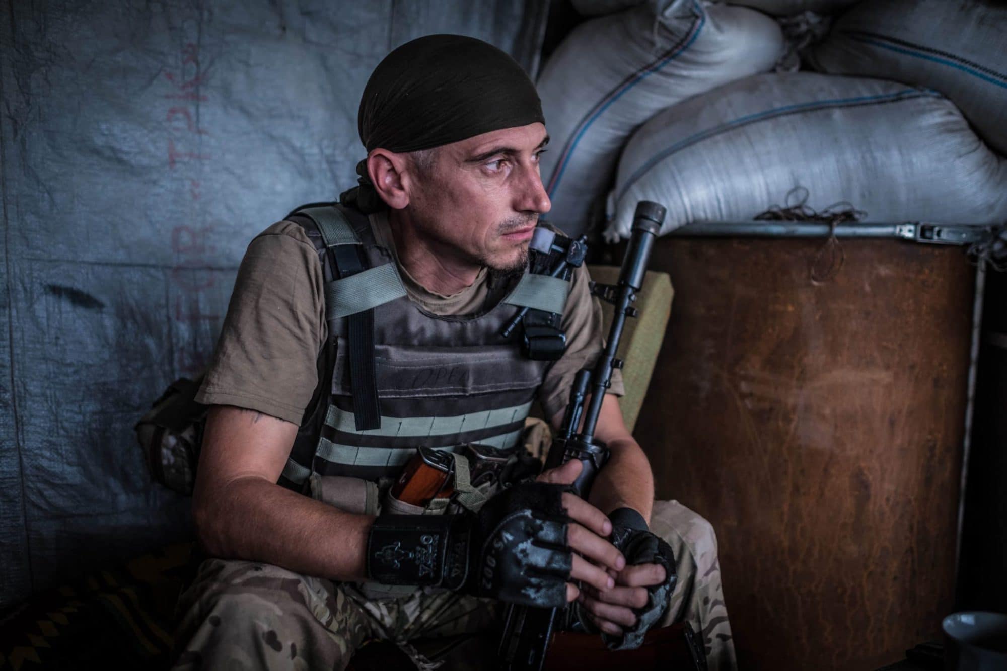 Soldier from "Ukraine's Voluntary Army", waiting at the front to the enemy